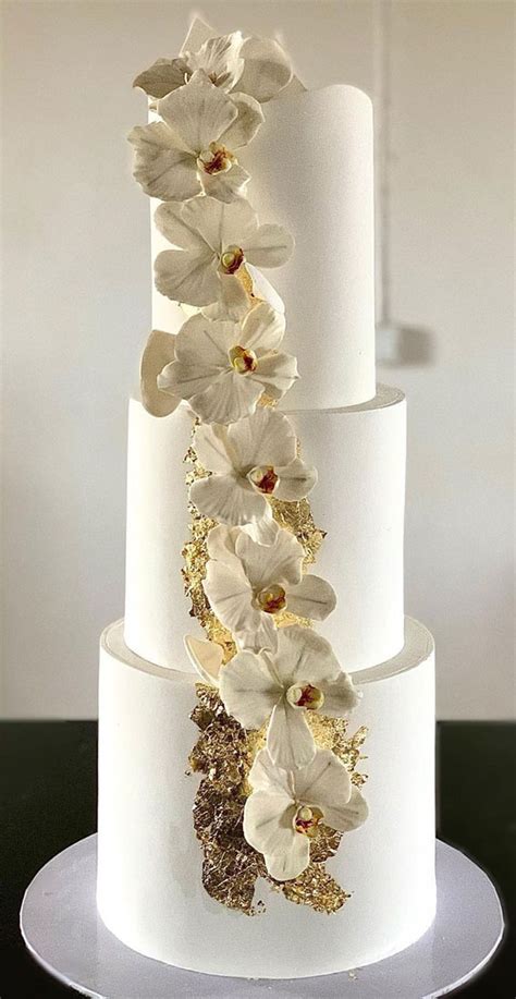 40 Beautiful Wedding Cake Trends 2023 : Simple White Cake with Cascading Orchid