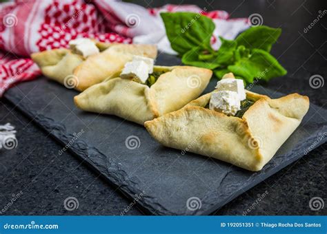 Delicious Lebanese Food, Spinach Sfiha with Ricotta Cheese on a Black ...