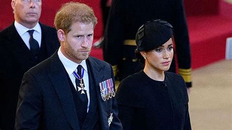 Why was Prince Harry spotted in a civilian suit at the Queen's funeral?