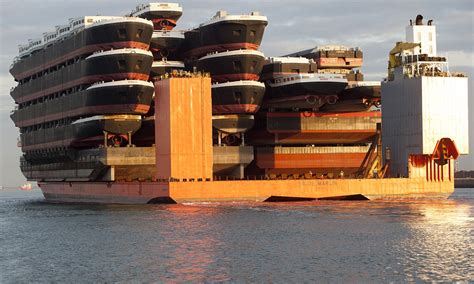 That's a load of ships! The carrier boat that can hold up to 22 barges - and even an oil rig ...