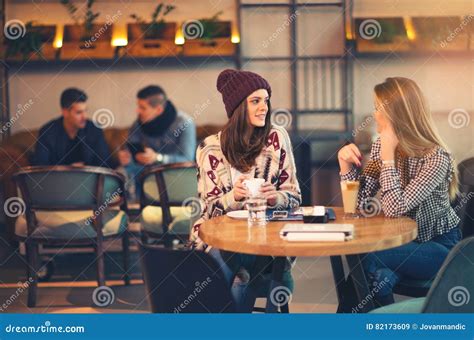 Two Friends Enjoying Coffee Together in a Coffee Shop Stock Image ...