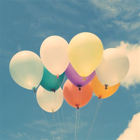 Assorted-color Aired Balloons Under Blue Sky · Free Stock Photo