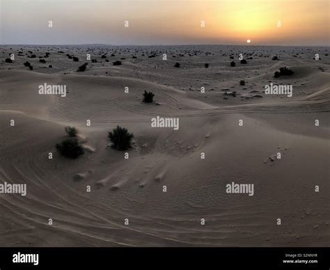 Dubai Desert Sunrise Stock Photo - Alamy