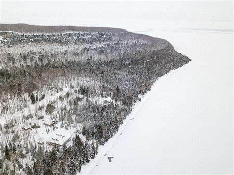 Aerial View Of Winter Vacation Lodges In Snow-covered Conifer Forest by ...