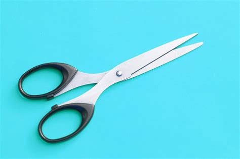 Free Image of Pair of Scissors Isolated on Cyan Background | Freebie ...