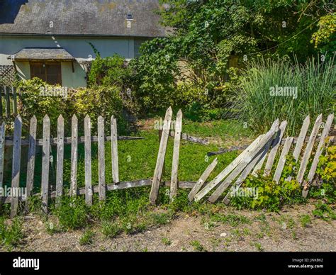 Broken garden fence - Martizay, France Stock Photo - Alamy