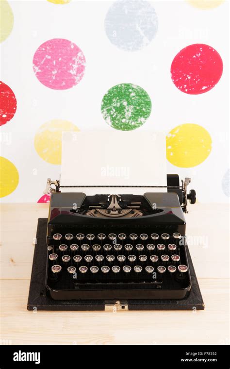 Vintage black old typewriter on colorful background Stock Photo - Alamy