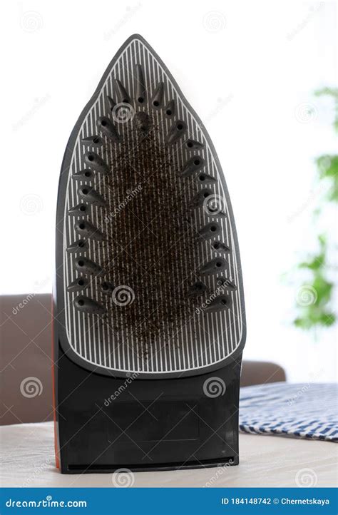 Iron with Damaged Soleplate Surface on Board Stock Photo - Image of ...