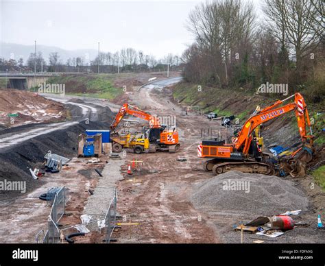 Diggers working on a road construction site Stock Photo, Royalty Free Image: 94379756 - Alamy