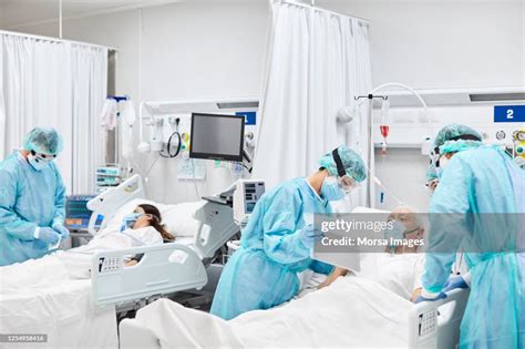 Doctors And Nurses Taking Care Of Patients In Icu High-Res Stock Photo ...