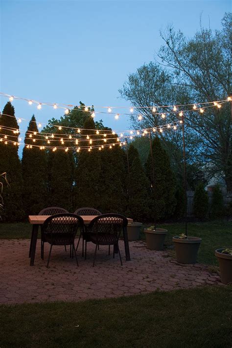 DIY Patio Arbor Using String Lights - The Honeycomb Home