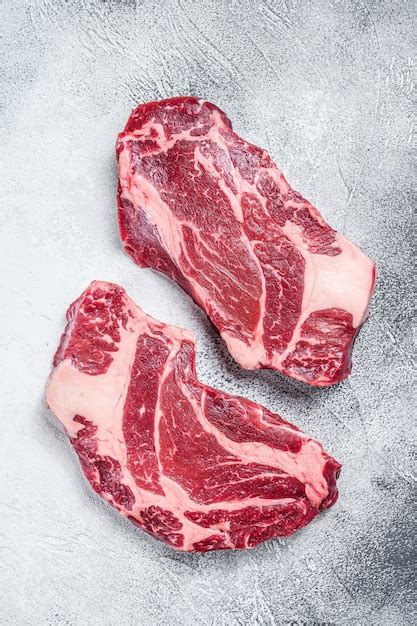 Premium Photo | Raw chuck roll steaks premium beef meat