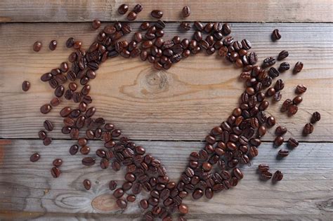 Premium Photo | Roasted coffee beans and heart