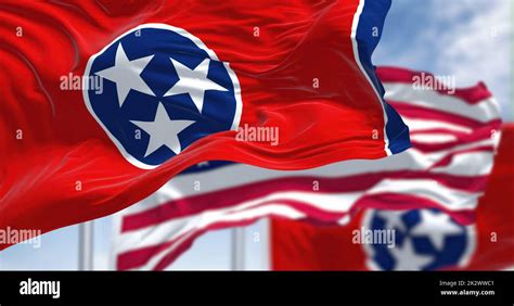 The Tennessee state flag waving along with the national flag of the ...