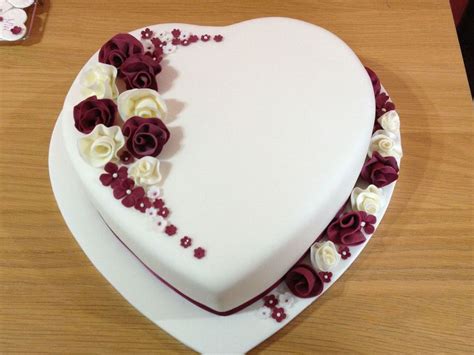 Heart Shaped Wedding Cake With Whimsical Flowers - CakeCentral.com