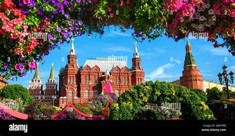 Flowers on Manezhnaya Square, Moscow, Russia. Historical Museum (it's written on roof) and ...