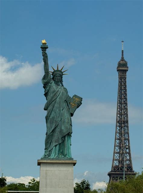 Paris, which also boasts a miniature Statue of Liberty, with the Eiffel Tower in the background ...