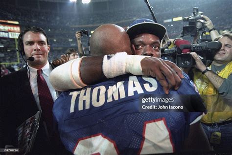 Dallas Cowboys Emmitt Smith hugging Buffalo Bills Thurman Thomas ...