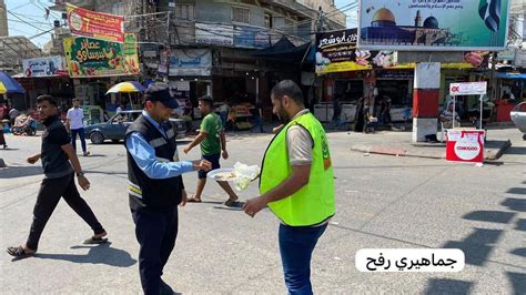 Rafah, southern Gaza Strip: Members of Hamas hand out sweets to passers ...