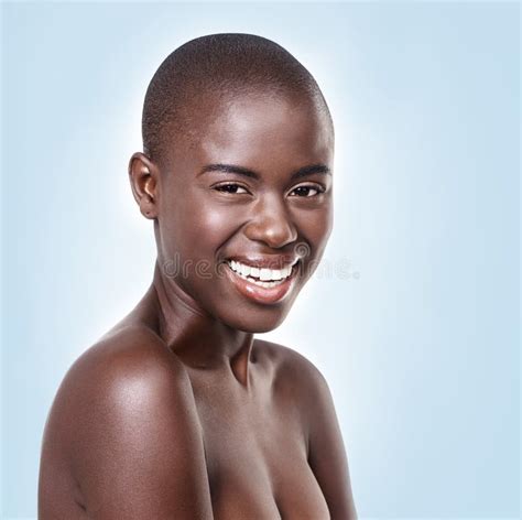 Happiness Depends upon Ourselves. Studio Portrait of a Beautiful Young African Woman on a Blue ...
