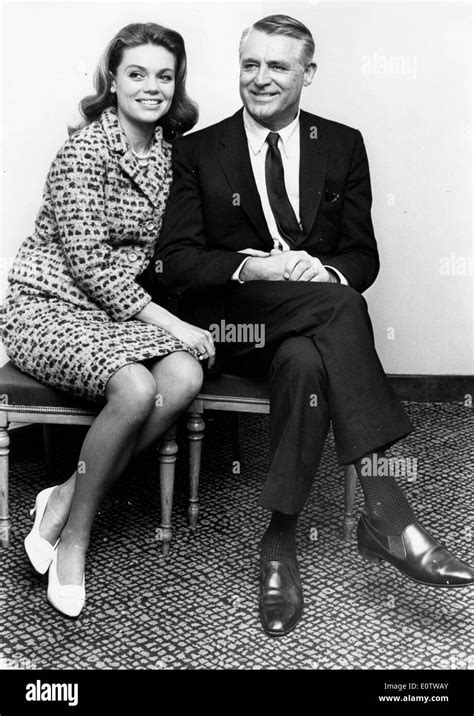 Actor Cary Grant sitting with wife Dyan Cannon Stock Photo - Alamy