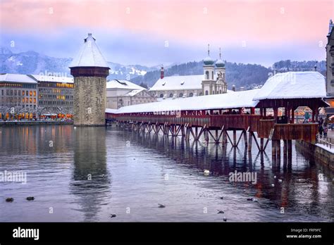 Lucerne, Switzerland, Chapel bridge, Water tower and Jesuit church on a winter evening Stock ...