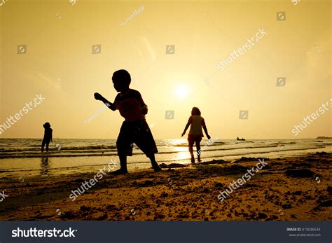 Silhouette Kids Playing Beach During Sunset Stock Photo 415036534 ...