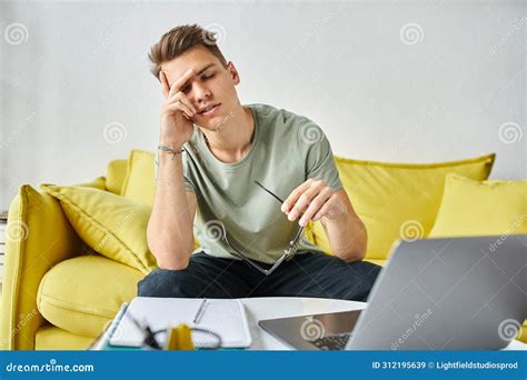 Tired Man in Yellow Couch with Stock Image - Image of academic, zoomer: 312195639
