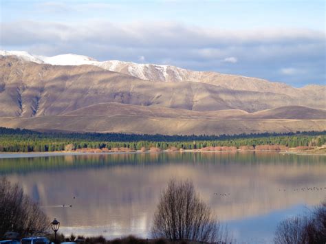 Moody Lake Tekapo in winter | Lake tekapo, New zealand landscape, Natural landmarks