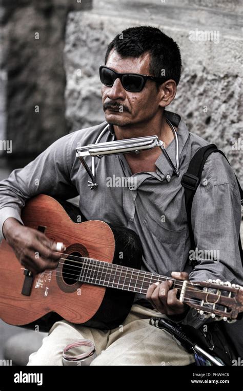 Blind man playing the guitar hi-res stock photography and images - Alamy