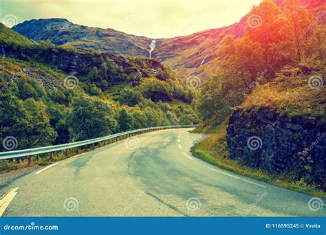 Mountain road at sunset stock image. Image of color - 116595245