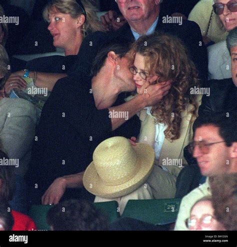 Tom Cruise kissing wife actress Nicole Kidman at Wimbledon tennis championships Stock Photo - Alamy