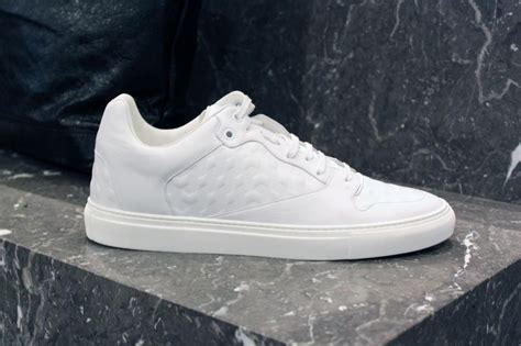 We love these simple white #Balenciaga sneakers, perfect for a sharp casual look this evening. # ...