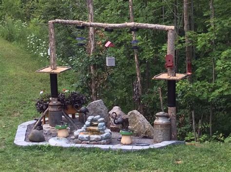 an outdoor area with rocks, candles and other items on the ground in ...