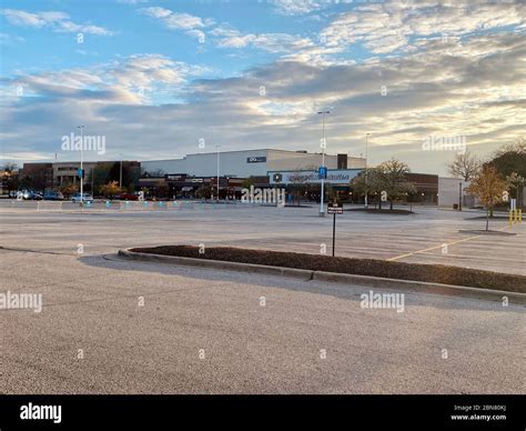 Empty shopping mall parking lot in Illinois during the COVID-19 pandemic. The only cars are ...