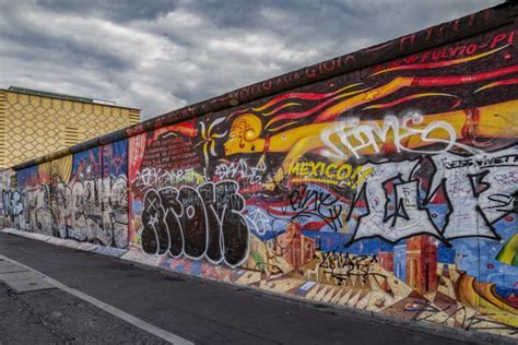 View of Part of the Old Existing Berlin Wall, Covered with Graffiti ...