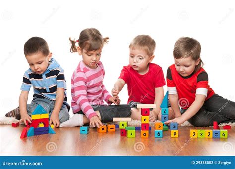 Four Kids Are Playing On The Floor Stock Photo - Image: 29338502