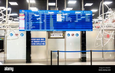 Departures information display with flights information in Almaty ...