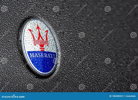 The Trident Logo of the Maserati Car Company on a Shiny Car Covered with Raindrops Editorial ...