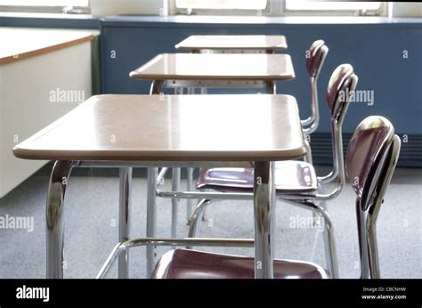 Desks in rows in an empty classroom Stock Photo, Royalty Free Image ...