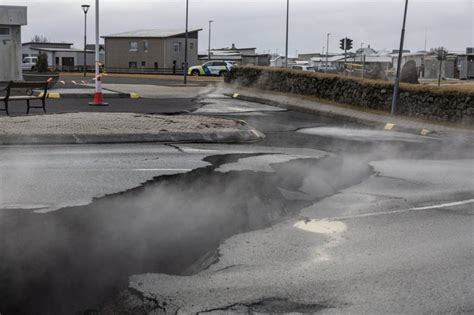 Iceland volcano in pictures: Steam pours from cracks, sinkholes collapse roads as eruption ...