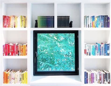 Built-in shelving with a view? Yes please! The color-coordinated books ...