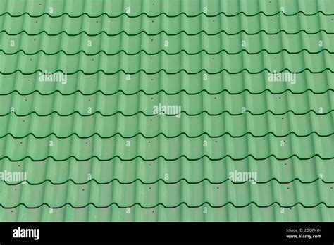 Green tile tiles and roof surface house pattern texture background Stock Photo - Alamy