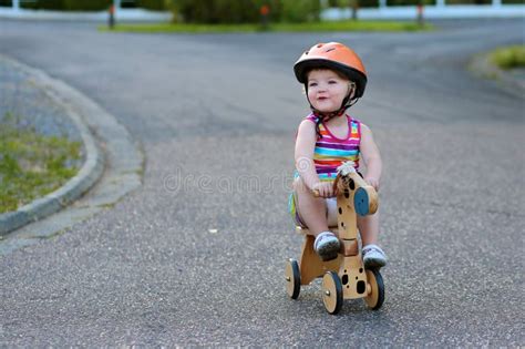 Little Girl Riding Wooden Tricycle on the Street Stock Image - Image of outdoors, balance: 51805869