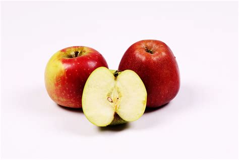 Two Red Apples and One Sliced Green Apple on White Background - High Quality Free Stock Images