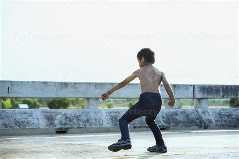 Healthy and happy kids doing leg strengthening and flexibility ...