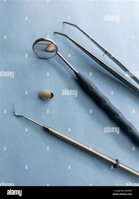 Set of dentist tools on blue background Stock Photo - Alamy