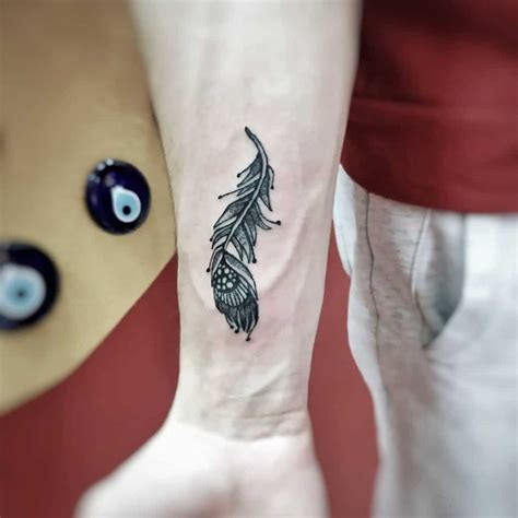 Share more than 70 peacock feather tattoo on wrist latest - in.cdgdbentre