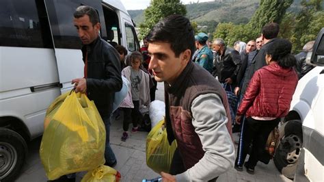 Thousands of ethnic Armenians flee disputed Nagorno-Karabakh territory ...