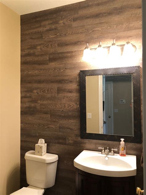 Vinyl plank wood wall using Peel and Stick fromLowe’s! | Wood wall bathroom, Wood tile bathroom ...